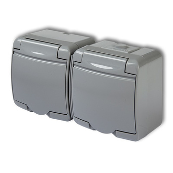 Gniazdo podwójne z uziemieniem SCHUKO 2x2P+Z klapka popielata; przesłony torów prądowych Karlik seria JUNIOR 10GHE-2sp kolor popielaty